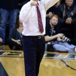Caption: Arizona coach Sean Miller signals his players during the first half of the team's NCAA college basketball game against Arizona on Wednesday, Feb. 24, 2016, in Boulder, Coio. (AP Photo/Cliff Grassmick)