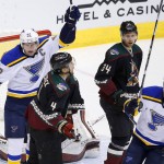 St. Louis Blues' David Backes (42) and Alexander Steen (20) celebrate a goal by Vladimir Tarasenko as Arizona Coyotes' Zbynek Michalek (4), of the Czech Republic, and Klas Dahlbeck (34), of Sweden, skate between them during the first period of an NHL hockey game Saturday, Feb. 20, 2016, in Glendale, Ariz. (AP Photo/Ross D. Franklin)