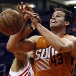 Phoenix Suns forward Kris Humphries (43) is fouled by Houston Rockets' Trevor Ariza during the third quarter of an NBA basketball game, Friday, Feb. 19, 2016, in Phoenix. The Rockets defeated the Suns 116-100. (AP Photo/Rick Scuteri)