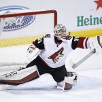 Arizona Coyotes goalie Louis Domingue (35) blocks a shot during the first period of an NHL hockey game against the Florida Panthers, Thursday, Feb. 25, 2016 in Sunrise, Fla. (AP Photo/Wilfredo Lee)