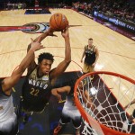 World forward Andrew Wiggins dunks past United States' Jahlil Okafor, left, during the second half of the NBA Rising Stars Challenge basketball game in Toronto on Friday, Feb. 12, 2016. (Elsa/Pool Photo via AP)