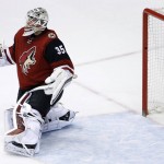 Arizona Coyotes' Louis Domingue gives up a goal to Los Angeles Kings' Dustin Brown during the second period of an NHL hockey game Tuesday, Feb. 2, 2016, in Glendale, Ariz. (AP Photo/Ross D. Franklin)