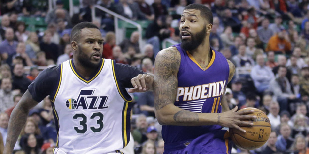 Phoenix Suns forward Markieff Morris (11) drives to the basket as Utah Jazz forward Trevor Booker (...