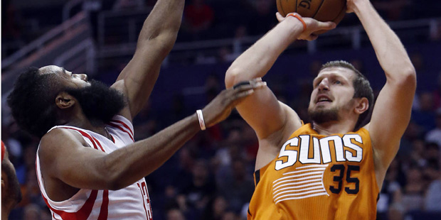 Phoenix Suns forward Mirza Teletovic (35) shoots over Houston Rockets guard James Harden during the...