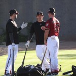 Catchers Brett Hayes (left) Tuffy Gosewisch (middle) chat with bench coach Glenn Sherlock during a break in workouts Wednesday afternoon. (Photo by Jessica Watts/Cronkite News)