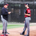 Pitching coach Mike Butcher (left) talks to Tyler Clippard before throwing in the bullpen. (Photo by Jessica Watts/Cronkite News)