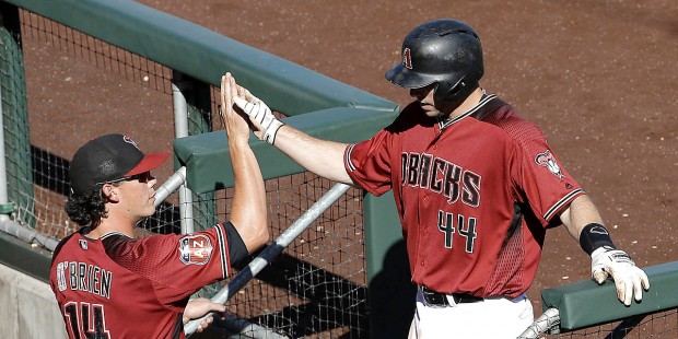 Arizona Diamondbacks' Paul Goldschmidt (44) is congratulated by Peter O'Brien after hitting a two-r...