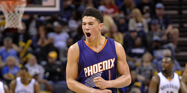 Phoenix Suns guard Devin Booker (1) reacts in the second half of an NBA basketball game against the...