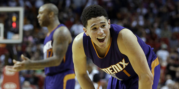 Phoenix Suns guard Devin Booker (1) reacts to a call by an official against his team during the sec...