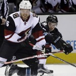 Arizona Coyotes' Max Domi (16) battles against San Jose Sharks defenseman Dylan DeMelo (74) during the second period of an NHL hockey game Sunday, March 20, 2016, in San Jose, Calif. (AP Photo/Marcio Jose Sanchez)