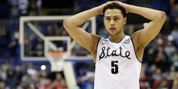 Michigan State's Bryn Forbes watches as Middle Tennessee prepares to shoot a free throw in the fina...