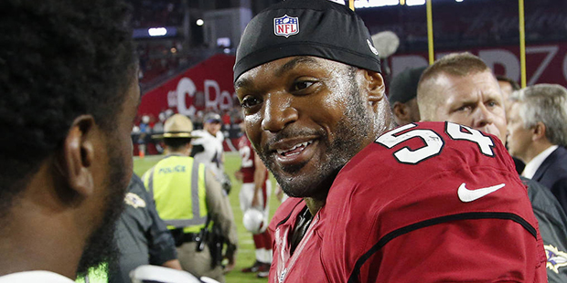 FILE - In this Oct. 26, 2015, file photo, Arizona Cardinals' Dwight Freeney (54) talks with Baltimo...