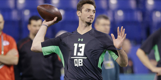 Memphis quarterback Paxton Lynch runs a drill at the NFL football scouting combine in Indianapolis,...