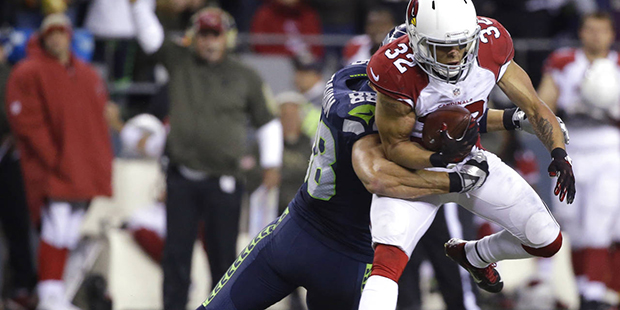 Arizona Cardinals free safety Tyrann Mathieu is tackled by Seattle Seahawks tight end Jimmy Graham ...