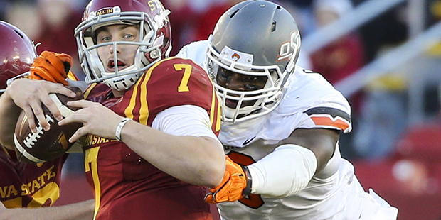 FILE - In this Nov. 14, 2015, file photo, Oklahoma State defensive end Emmanuel Ogbah, right, sacks...