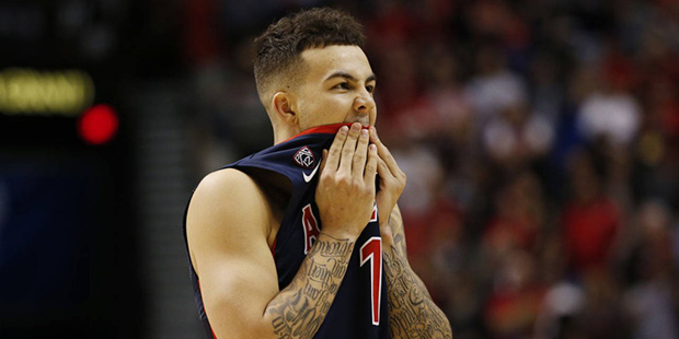 Arizona guard Gabe York reacts with less than a second left in regulation in an NCAA college basket...