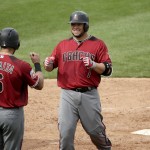 Arizona Diamondbacks' Welington Castillo (7) celebrates with David Peralta (6) after Castillo hit a two-run home run during the third inning of a spring training baseball game against the Seattle Mariners, Monday, March 7, 2016, in Peoria, Ariz. (AP Photo/Charlie Riedel)