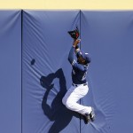 San Diego Padres' Jon Jay in unable to get to a home run ball hit by Arizona Diamondbacks' Peter O'Brien during the second inning of a spring training baseball game, Tuesday, March 8, 2016, in Peoria, Ariz. (AP Photo/Ross D. Franklin)