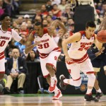 Wisconsin players, from left, forward Nigel Hayes, forward Vitto Brown and guard Bronson Koenig sprint down the court after Koenig recovered a Pittsburgh turnover during the second half of a college basketball game in the NCAA men's tournament, Friday, March 18, 2016, in St. Louis. Wisconsin won 47-43. (Chris Lee/St. Louis Post-Dispatch via AP)