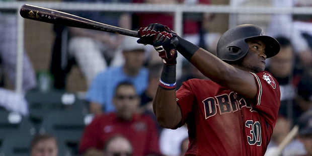 Arizona Diamondbacks' Socrates Brito watches his RBI double against the Los Angeles Angels during t...