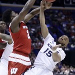 Xavier's Myles Davis (15) steals the ball from Wisconsin's Khalil Iverson during the first half of a second-round men's college basketball game in the NCAA Tournament, Sunday, March 20, 2016, in St. Louis. (AP Photo/Charlie Riedel)