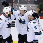 San Jose Sharks' Tomas Hertl (48), of the Czech Republic, celebrates his goal against the Arizona Coyotes with Joe Thornton (19) and Joe Pavelski (8) during the second period of an NHL hockey game Thursday, March 17, 2016, in Glendale, Ariz. (AP Photo/Ross D. Franklin)