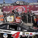 Kevin Harvick takes a drink as he celebrates with crew members in victory lane after winning a NASCAR Sprint Cup Series auto race at Phoenix International Raceway, Sunday, March 13, 2016, in Avondale, Ariz. (AP Photo/Ross D. Franklin)
