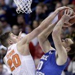 Syracuse's Tyler Lydon, left, blocks a shot by Middle Tennessee's Reggie Upshaw Jr. during the second half of a second-round men's college basketball game in the NCAA Tournament, Sunday, March 20, 2016, in St. Louis.  (AP Photo/Charlie Riedel)