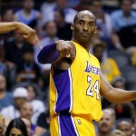 
              Los Angeles Lakers forward Kobe Bryant (24) signals the basket is good during the first half of an NBA basketball game against the Phoenix Suns, Wednesday, March 23, 2016, in Phoenix. (AP Photo/Matt York)
            