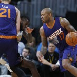 Phoenix Suns forward P.J. Tucker, right, drives for a basket as center Alex Len, left, of Ukraine, sets a pick on Denver Nuggets guard JaKarr Sampson during the second half of an NBA basketball game Thursday, March 10, 2016, in Denver. The Nuggets won 116-98. (AP Photo/David Zalubowski)