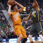 Phoenix Suns' Devin Booker (1) looks to pass the ball as Utah Jazz's Rodney Hood (5) defends during the first half of an NBA basketball game Thursday, March 17, 2016, in Salt Lake City. (AP Photo/Kim Raff)