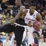Maryland forward Robert Carter (4) grabs a rebound against Hawaii forward Michael Thomas during the second half of a second-round men's college basketball game in the NCAA Tournament in Spokane, Wash., Sunday, March 20, 2016. Maryland won 73-60. (AP Photo/Young Kwak)