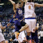 Phoenix Suns' Devin Booker drives against New York Knicks' Robin Lopez (8) during the second half of an NBA basketball game, Wednesday, March 9, 2016, in Phoenix. (AP Photo/Matt York)