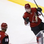 Arizona Coyotes' Alex Tanguay (40) celebrates his goal against the Florida Panthers with Anthony Duclair (10) during the third period of an NHL hockey game Saturday, March 5, 2016, in Glendale, Ariz. The Coyotes defeated the Panthers 5-1. (AP Photo/Ross D. Franklin)