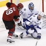 Arizona Coyotes' Shane Doan (19) has his shot blocked by Tampa Bay Lightning's Anton Stralman (6) who helped out goalie Ben Bishop (30) during the second period of an NHL hockey game Saturday, March 19, 2016, in Glendale, Ariz. (AP Photo/Ross D. Franklin)
