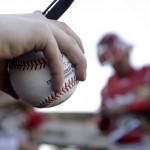 A fan waits for an autograph from Los Angeles Angels catcher Carlos Perez before the Angels' spring baseball game against the Arizona Diamondbacks in Scottsdale, Ariz., Tuesday, March 8, 2016. (AP Photo/Chris Carlson)