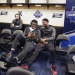 Xavier players wait in the locker room before practice for a second-round men's college basketball game in the NCAA Tournament, Saturday, March 19, 2016, in St. Louis. Xavier plays Wisconsin on Sunday. (AP Photo/Charlie Riedel)