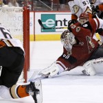 Anaheim Ducks' Rickard Rakell (67), of Sweden, sends the puck past Arizona Coyotes' Niklas Treutle, right, of Germany, for a goal during the first period of an NHL hockey game Thursday, March 3, 2016, in Glendale, Ariz. (AP Photo/Ross D. Franklin)