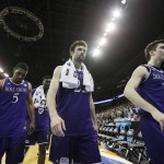From left to right, Holy Cross guard Cullen Hamilton (5), guard Robert Champion (22) and guard Matt Zignorski (31) walk off the court after the second half of a first-round men's college basketball game in the NCAA Tournament in Spokane, Wash., Friday, March 18, 2016. (AP Photo/Young Kwak)