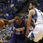Phoenix Suns guard Brandon Knight (3) drives against Minnesota Timberwolves guard Ricky Rubio (9), of Spain, during the first half of an NBA basketball game in Minneapolis, Monday, March 28, 2016. (AP Photo/Ann Heisenfelt)