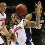 Arizona guard Gabe York (1) steals the ball from Colorado forward Josh Scott (40) during the first half of an NCAA college basketball game in the quarterfinald of the Pac-12 men's tournament Thursday, March 10, 2016, in Las Vegas. (AP Photo/John Locher)