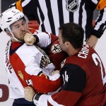 Arizona Coyotes' Kyle Chipchura, right, lands a punch on Florida Panthers' Alex Petrovic as the two fight during the third period of an NHL hockey game Saturday, March 5, 2016, in Glendale, Ariz. The Coyotes defeated the Panthers 5-1. (AP Photo/Ross D. Franklin)