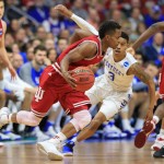 Indiana's Kevin Yogi Ferrell, center, drives around Kentucky's Tyler Ulis (3) during a second-round men's college basketball game in the NCAA Tournament in Des Moines, Iowa, Saturday, March 19, 2016. (AP Photo/Nati Harnik)