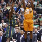 Phoenix Suns' Ronnie Price (14) shoots as Utah Jazz's Shelvin Mack (8) defends during the first half of an NBA basketball game Thursday, March 17, 2016, in Salt Lake City. (AP Photo/Kim Raff)