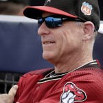 Arizona Diamondbacks manager Chip Hale watches during the first inning of a spring training baseball game against the Seattle Mariners Monday, March 7, 2016, in Peoria, Ariz. (AP Photo/Charlie Riedel)
