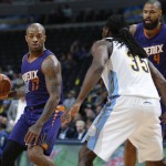 Phoenix Suns forward P.J. Tucker, left, pulls in a loose ball as Denver Nuggets forward Kenneth Faried defends in the first half of an NBA basketball game Thursday, March 10, 2016, in Denver. (AP Photo/David Zalubowski)