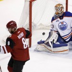 Arizona Coyotes' Tobias Rieder (8), of Germany, celebrates his goal against Edmonton Oilers' Cam Talbot, right, during the second period of an NHL hockey game, Tuesday, March 22, 2016, in Glendale, Ariz. (AP Photo/Ross D. Franklin)