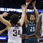 Green Bay forward Jamar Hurdle (23) shoots over Texas A&M center Tyler Davis (34) in the second half of a first-round men's college basketball game in the NCAA Tournament, Friday, March 18, 2016, in Oklahoma City. (AP Photo/Sue Ogrocki)
