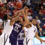 Weber State's Zach Braxton (44) competes for a rebound against Xavier forward Jalen Reynolds, left, and guard Trevon Bluiett during the first half of an NCAA college basketball game in the NCAA men's tournament, Friday, March 18, 2016, in St. Louis. (Chris Lee/St. Louis Post-Dispatch via AP)