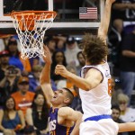New York Knicks' Robin Lopez blocks the shot of Phoenix Suns' Alex Len (21) during the first half of an NBA basketball game, Wednesday, March 9, 2016, in Phoenix. (AP Photo/Matt York)